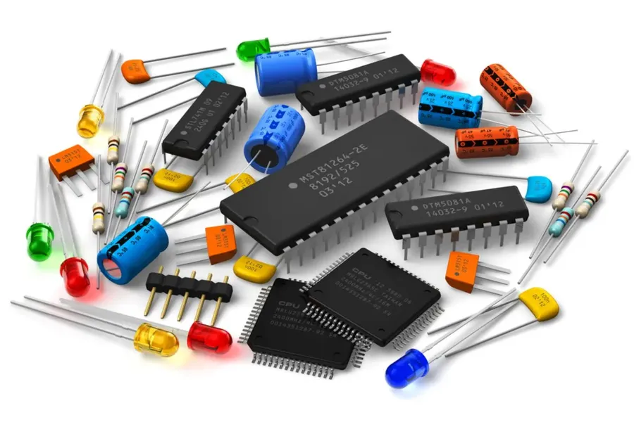 Hands holding various electronic components or a person browsing through online electronic component listings.