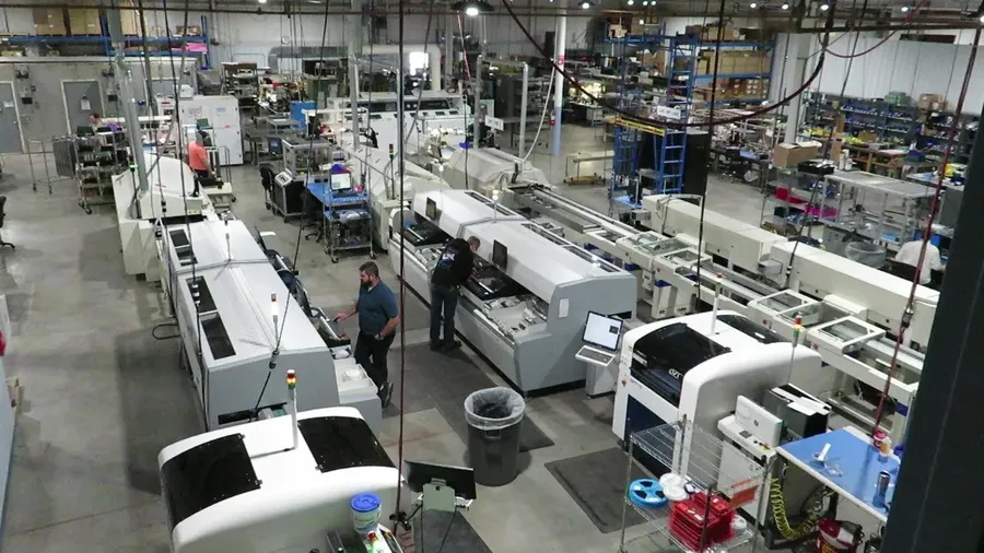 An image of a complete SMT assembly line with various machines.