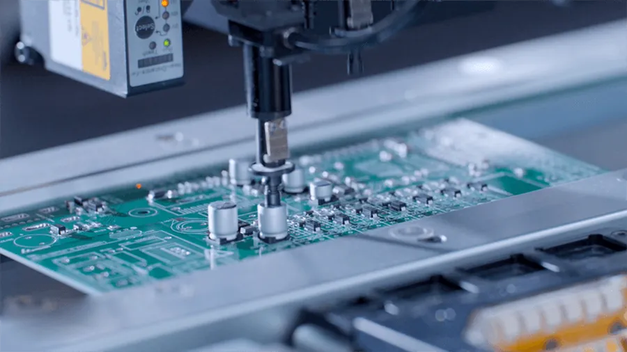 A close up of a PCB undergoing surface mount assembly.