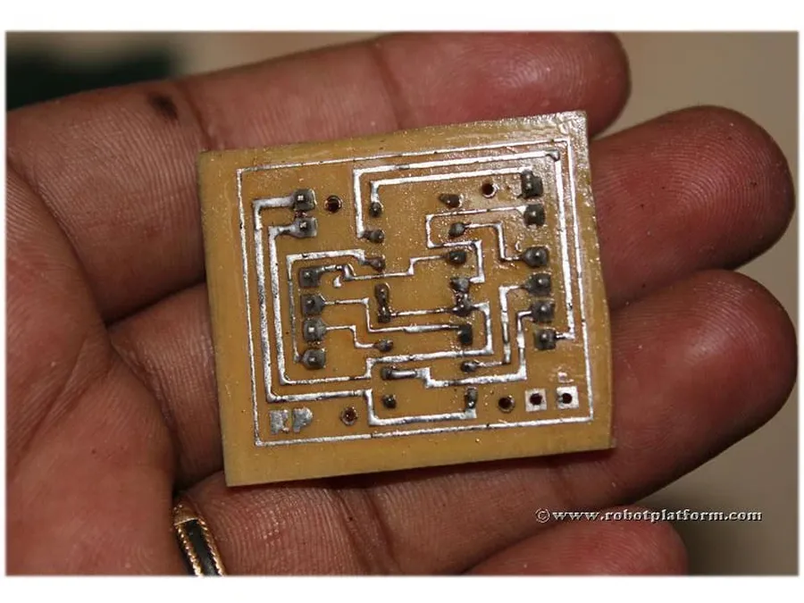 A visual of PCB etching process, revealing the copper layer pattern.