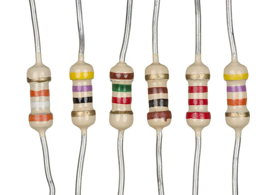 Several resistors with different color bands and resistance values.