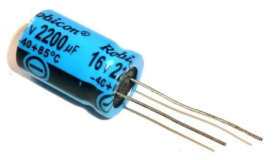 A selection of electronic capacitors, showcasing different types and values.