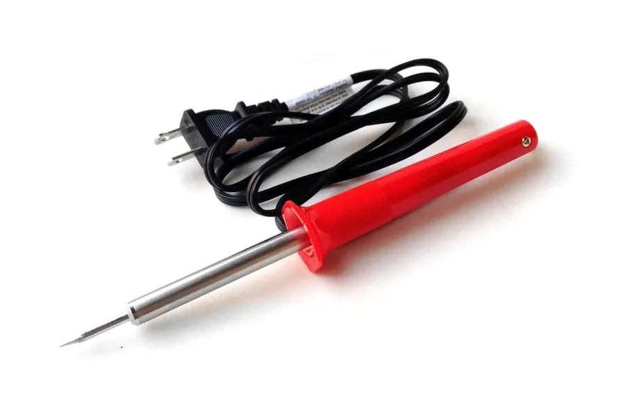 A set of soldering iron, solder, wire cutters and other tools for electronics projects