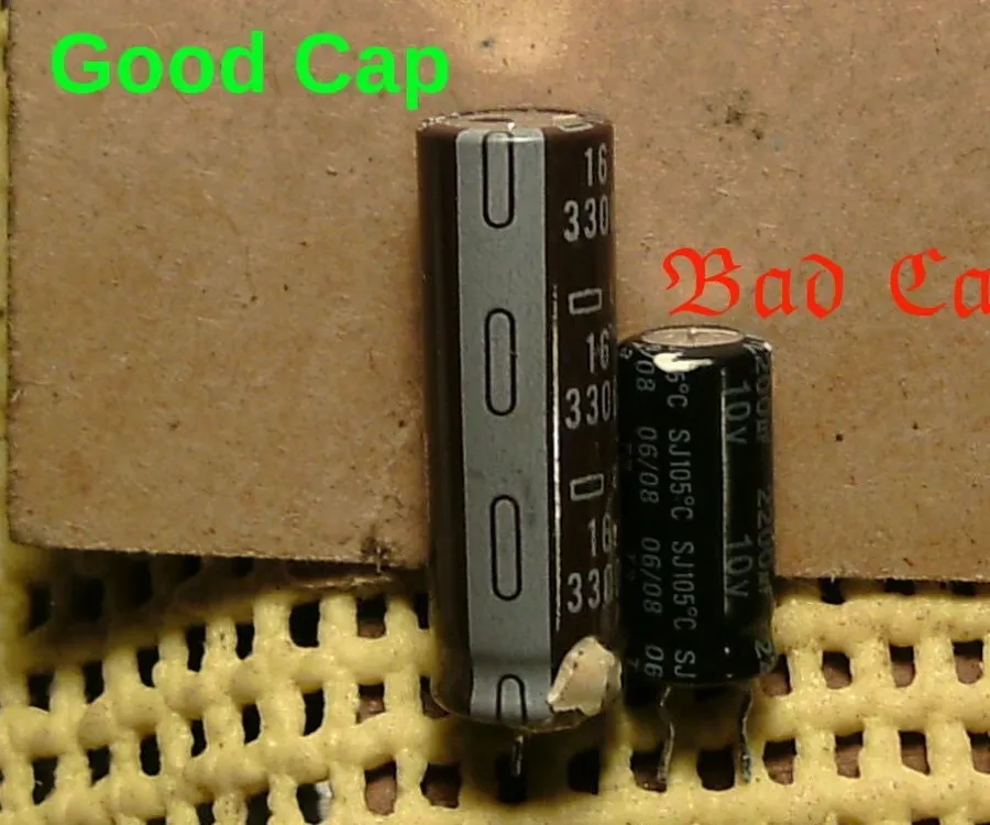 A visibly damaged capacitor showing signs of failure.