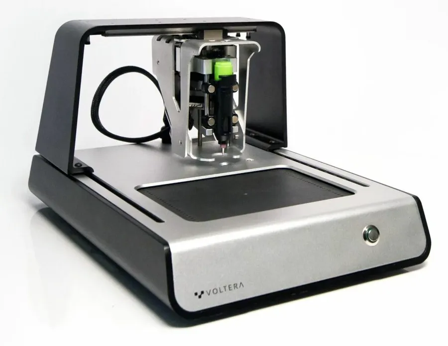 An industrial PCB printer in a manufacturing setting.