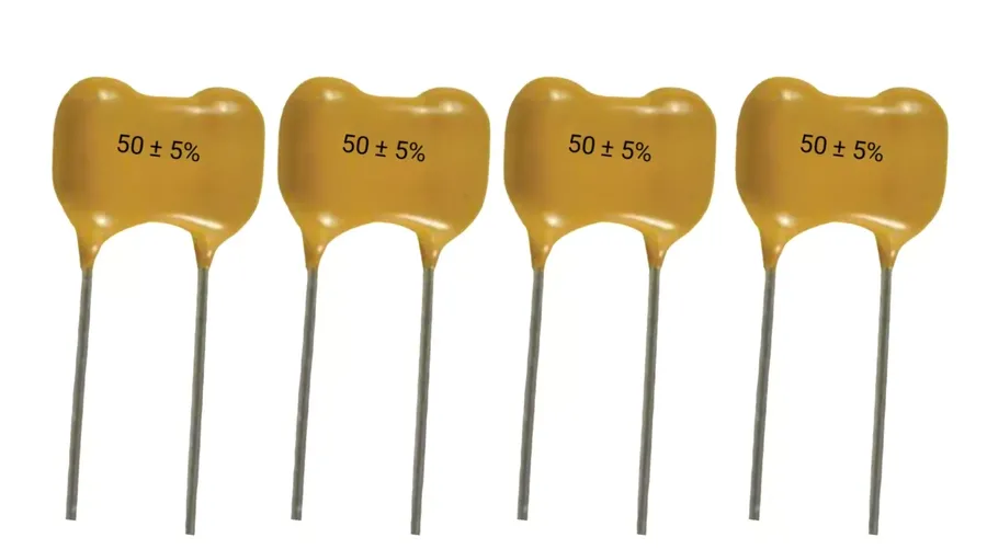 A display of different mica capacitor types, such as disc, dipped, and SMD.