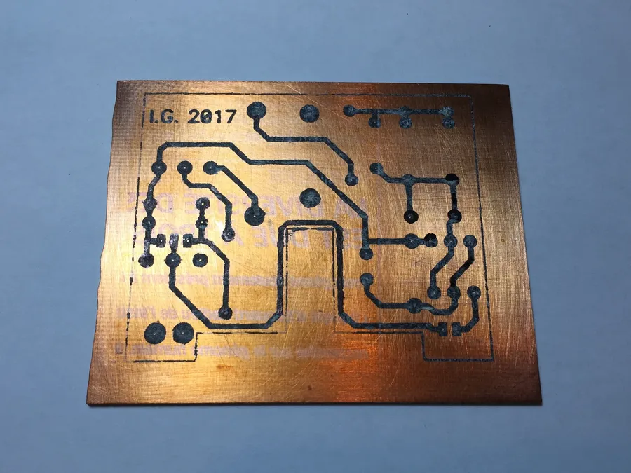 A PCB being exposed to UV light for photo etching.