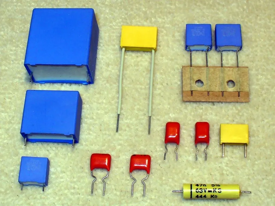 An assortment of C65R capacitors of different ratings and sizes.