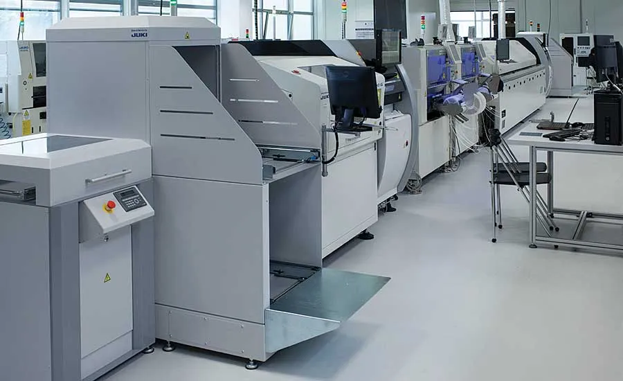 A PCB assembly production line with various machines and workers.