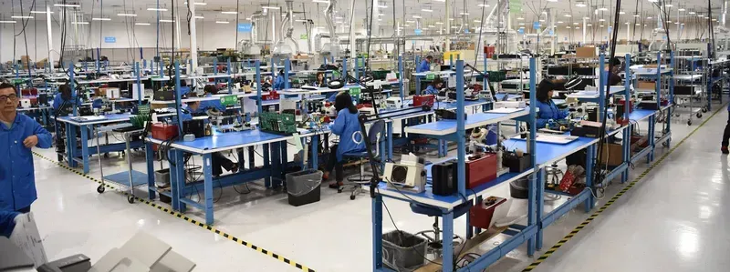 An automated PCB manufacturing line in a factory workshop