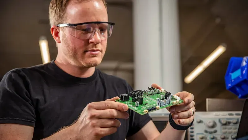 An engineer working on PCB design software